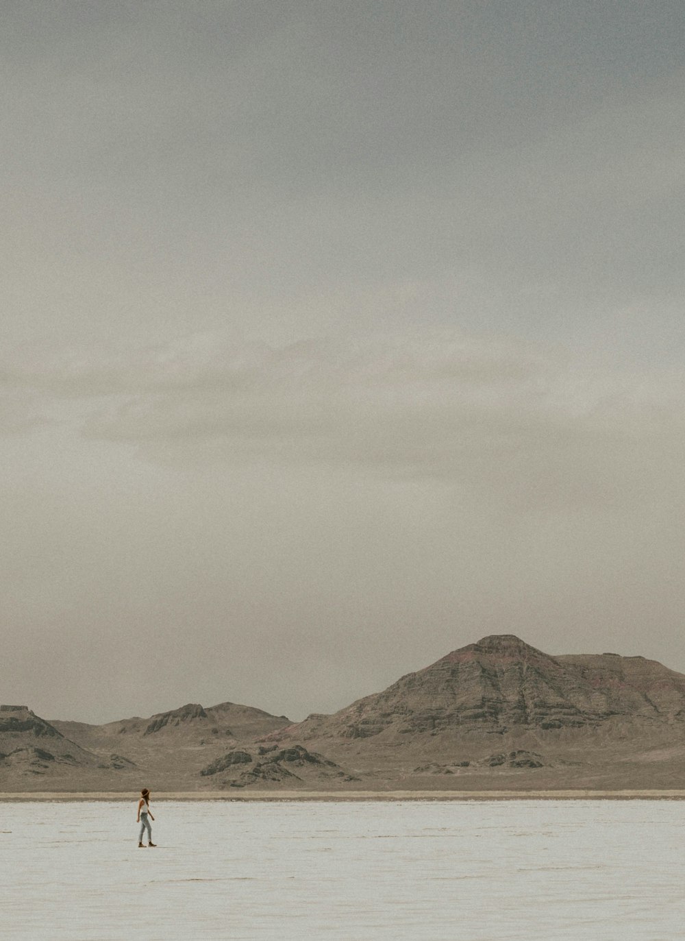 a person standing in the middle of a large body of water