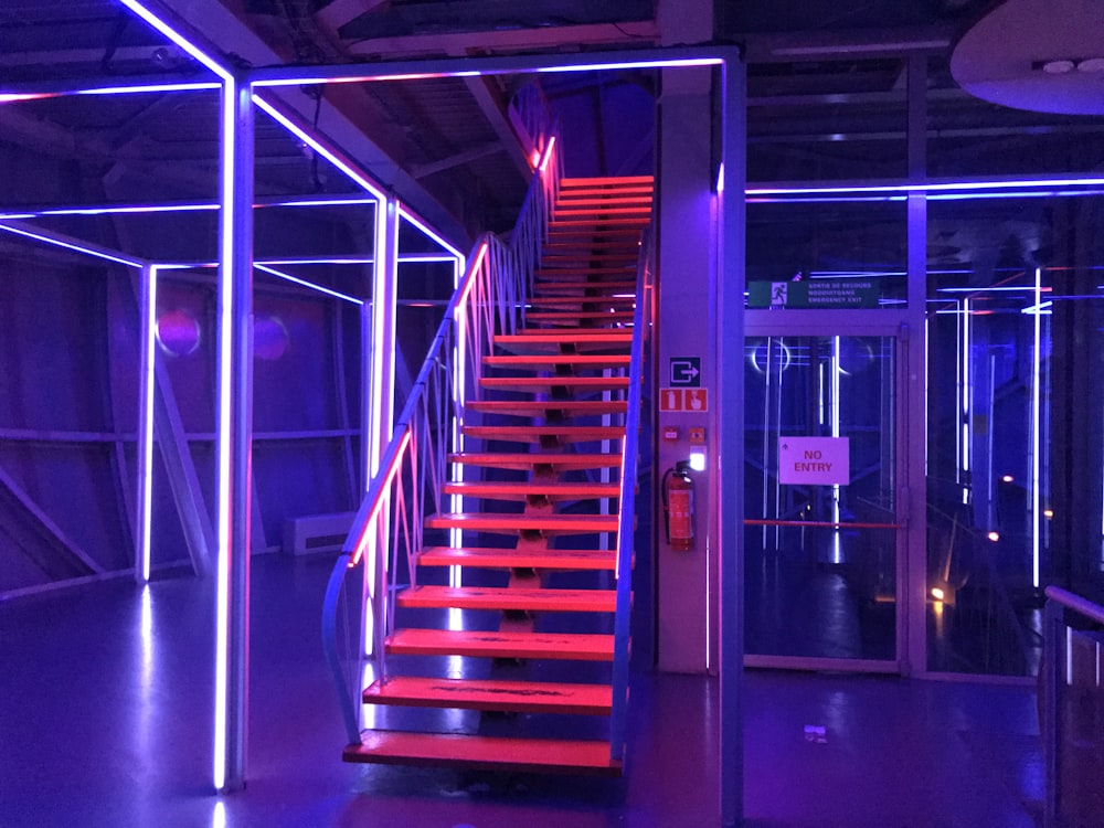 a set of stairs with red and blue lights
