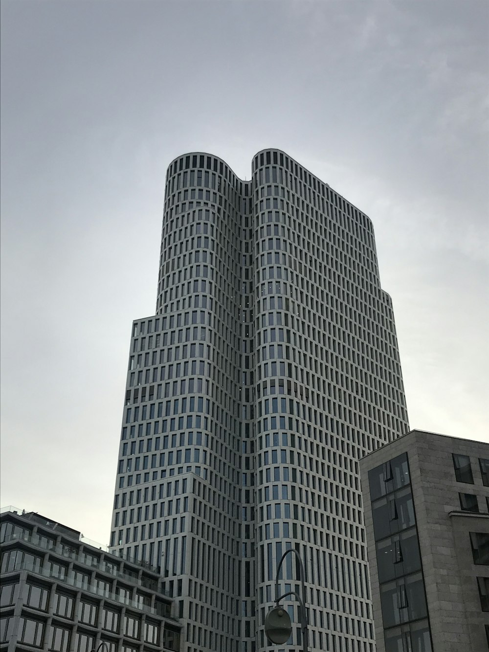 a very tall building with a clock in front of it