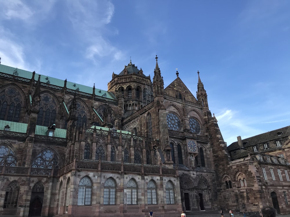 a large building with many windows and a sky background