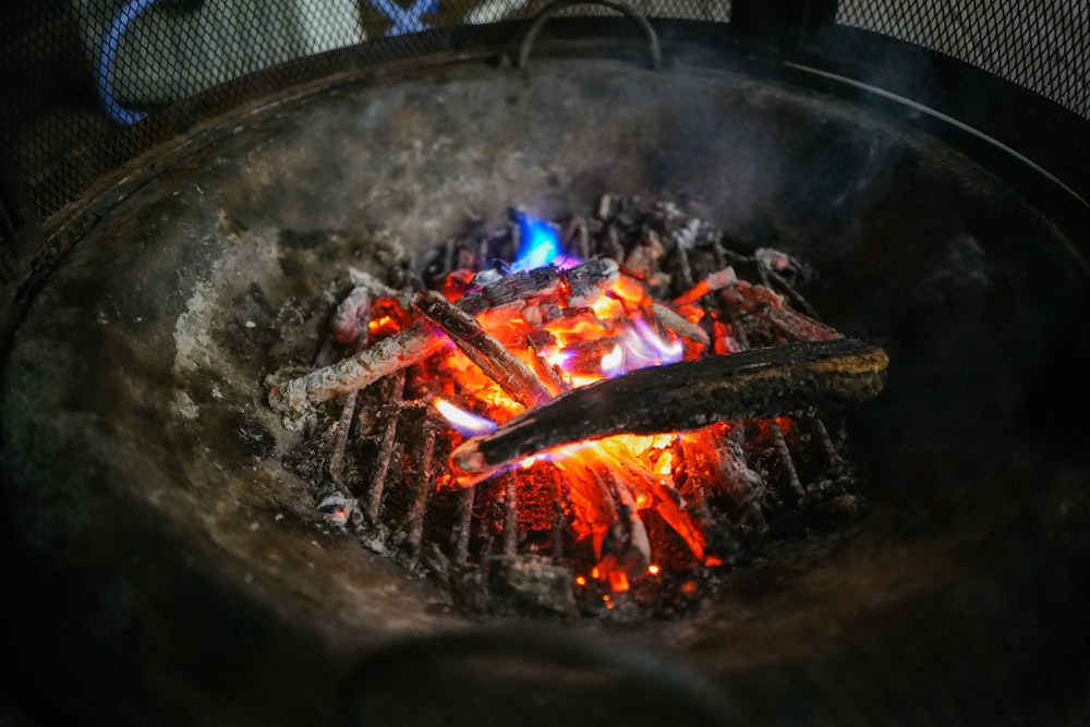 a close up of a grill with flames