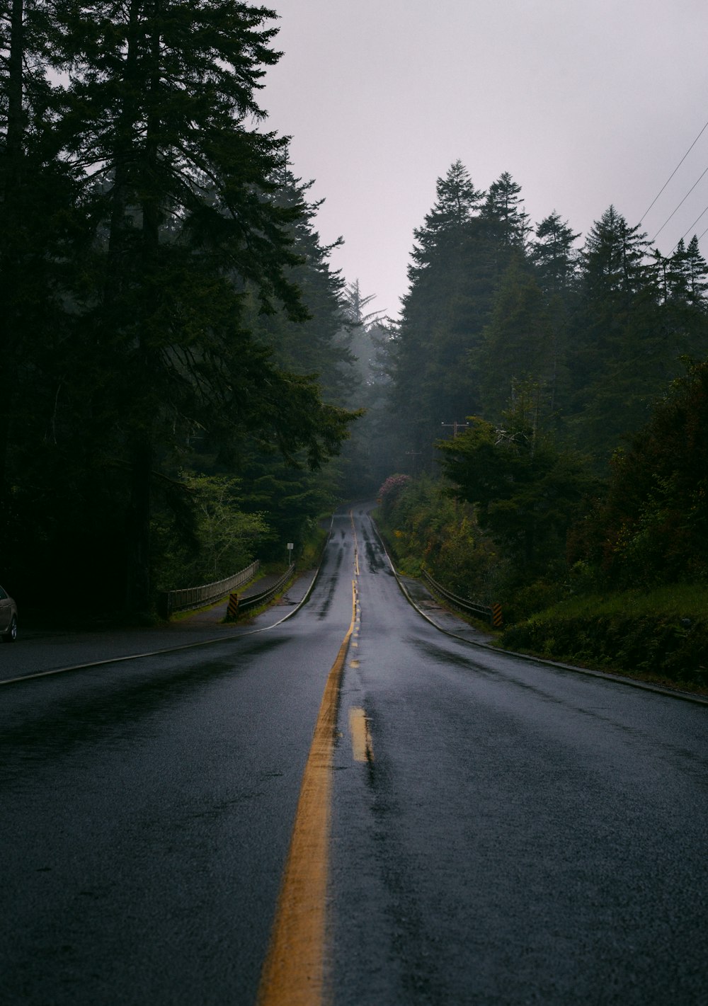 a road with a yellow line on the side of it