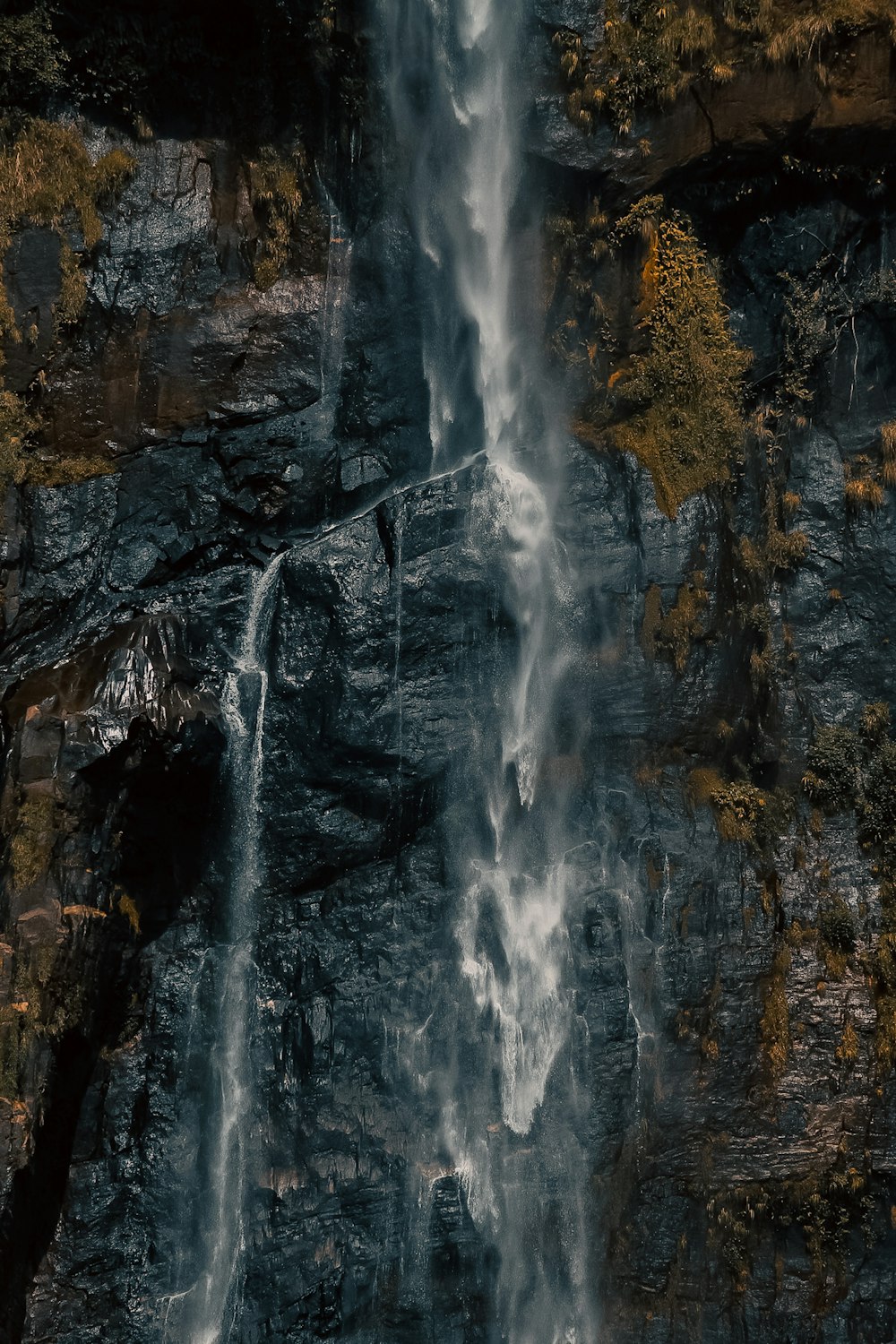 a waterfall is shown from above in the woods