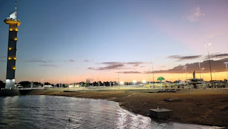 A serene sunset view over an iconic international landmark, inviting travelers to unwind.