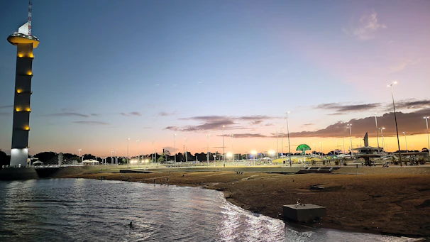 A serene sunset view over an iconic international landmark, inviting travelers to unwind.