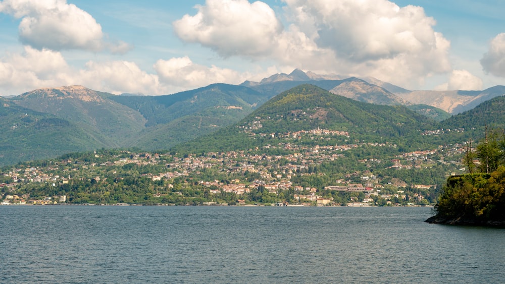 a body of water with mountains in the background