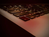 Top-down shot of a keyboard with some keys slightly yellowed from age.