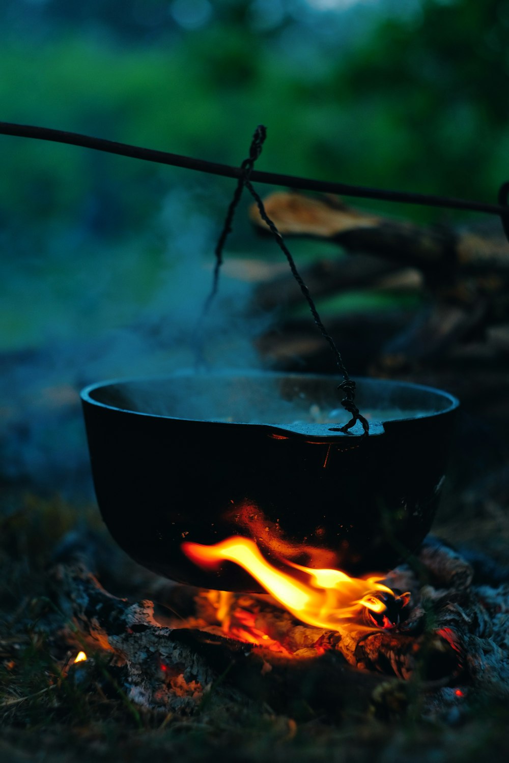 a bowl on fire with a stick sticking out of it