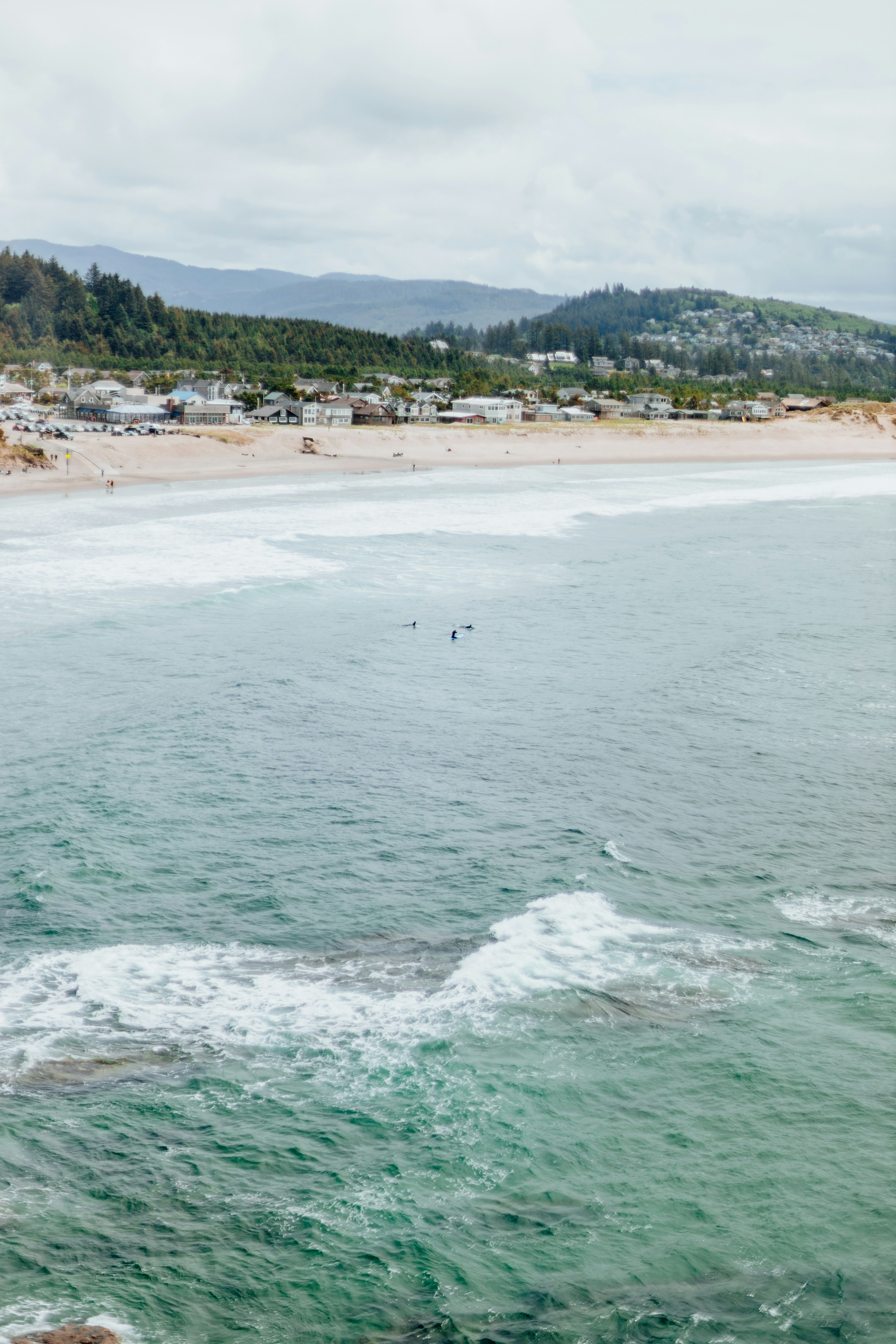 a person riding a surfboard on top of a wave in the ocean