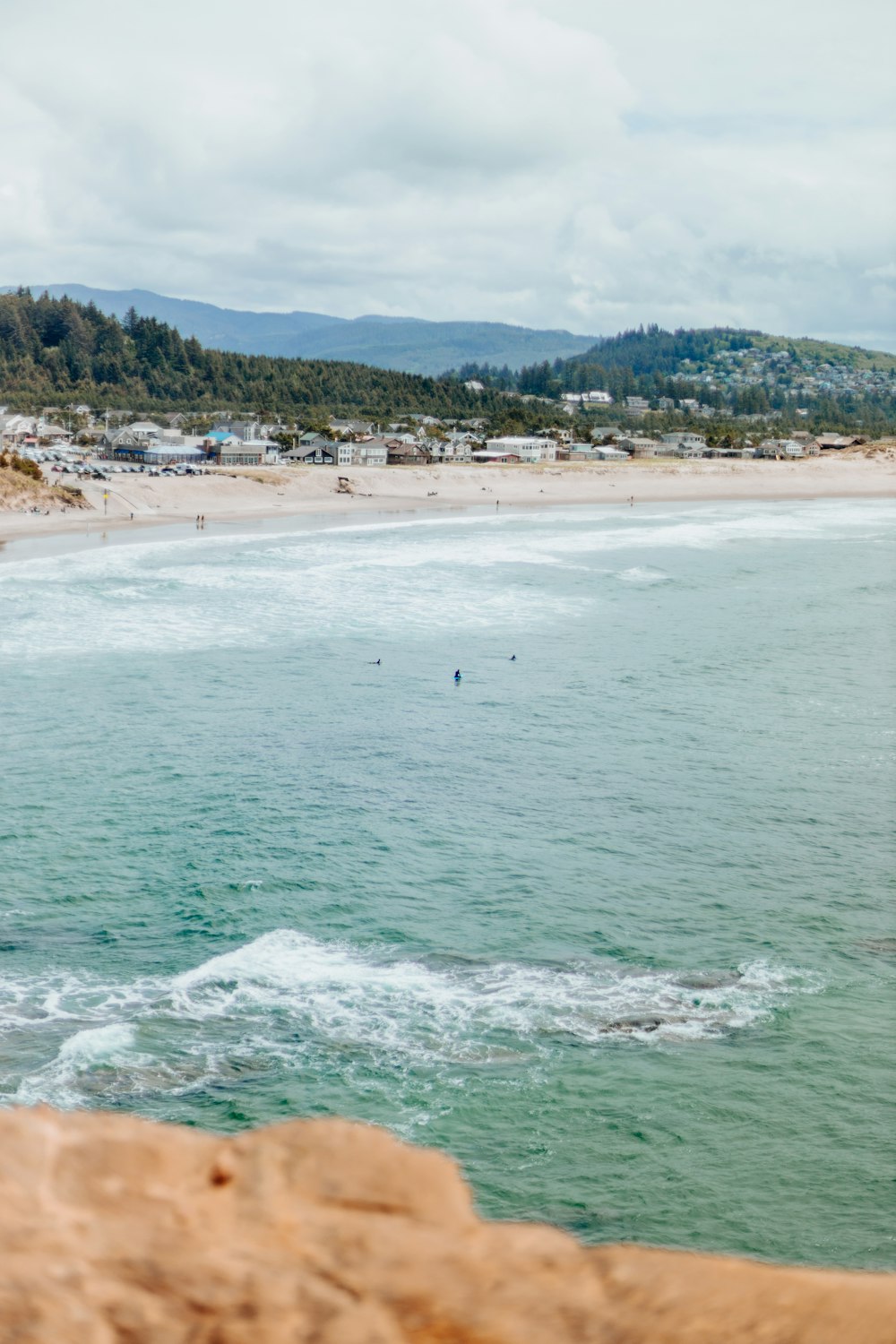 a view of a beach from a cliff