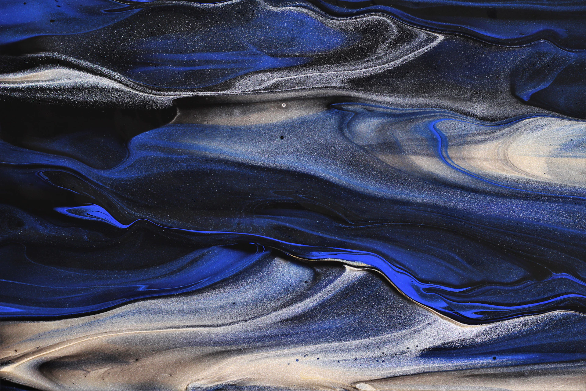 a blue and white abstract painting with a black background