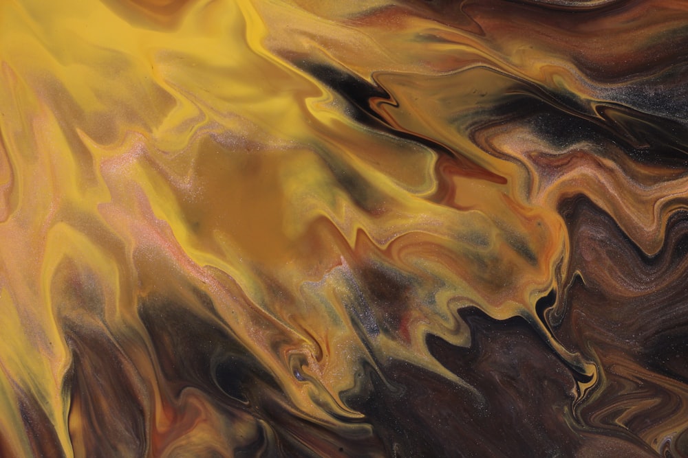a painting of a yellow and brown swirl
