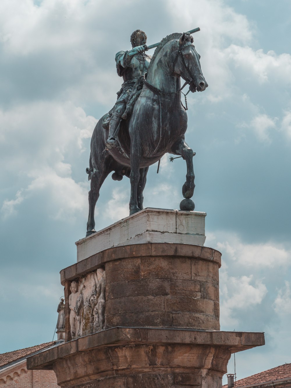 a statue of a man riding on the back of a horse