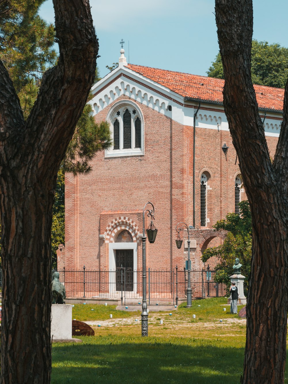 a large brick building with a clock on the front of it