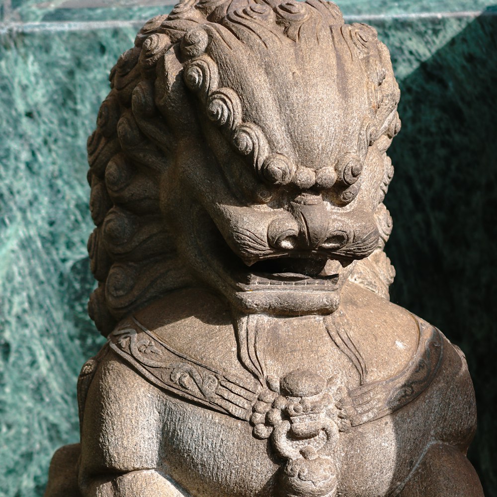 a statue of a lion with a crown on it's head