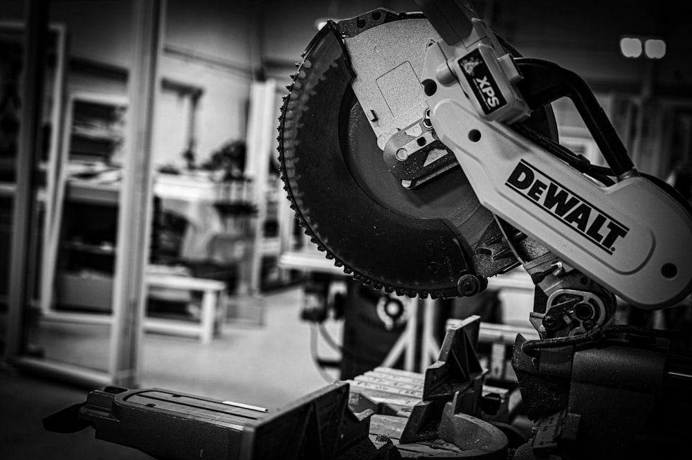 a black and white photo of a chainsaw in a garage