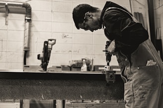 a man working on a piece of wood