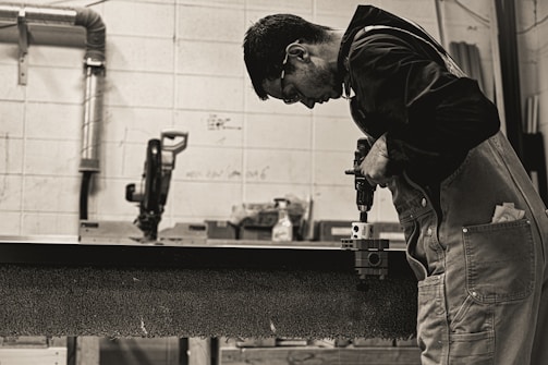 a man working on a piece of wood
