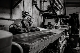 Inside view of a busy workshop with carpenters working on set pieces and repairs.