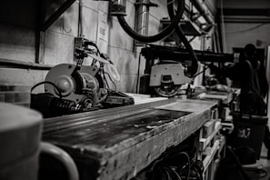A workshop scene with machinery and tools in use.
