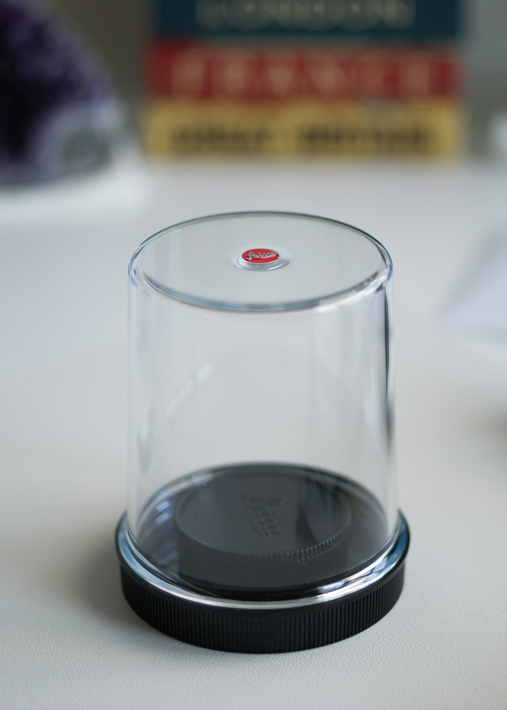 a glass cup sitting on top of a table