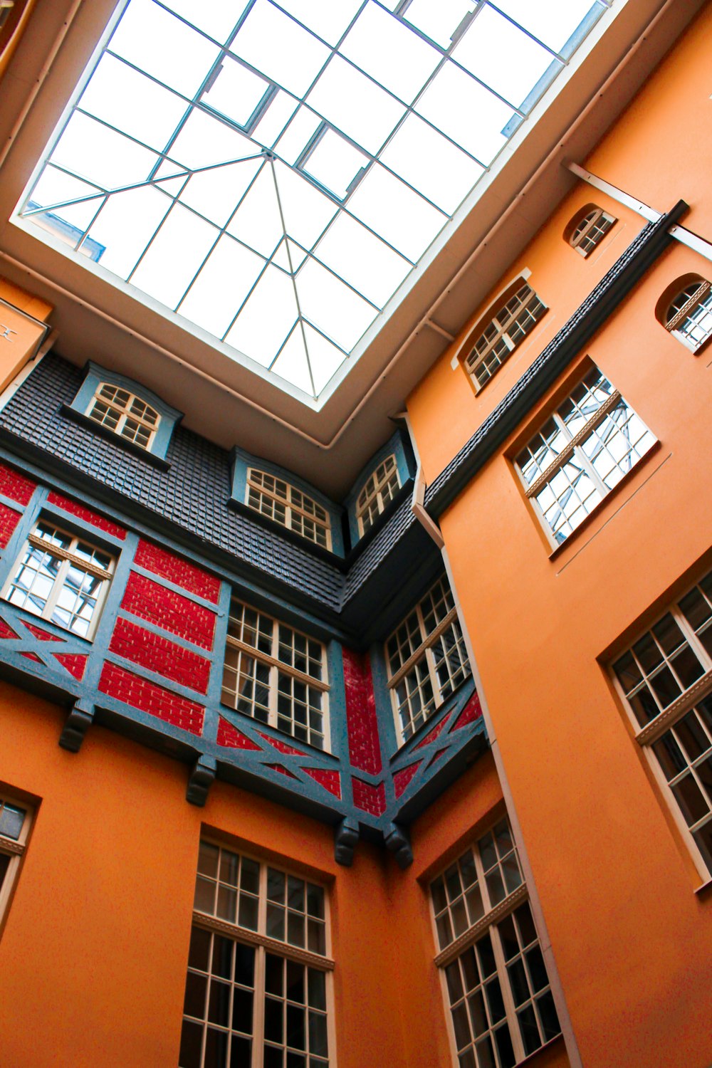 a large orange building with a skylight above it