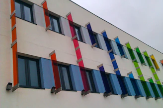 A freshly painted modern building exterior showcasing vibrant colors and smooth finish.