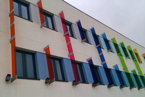Photo of a freshly painted modern building exterior with vibrant colors.
