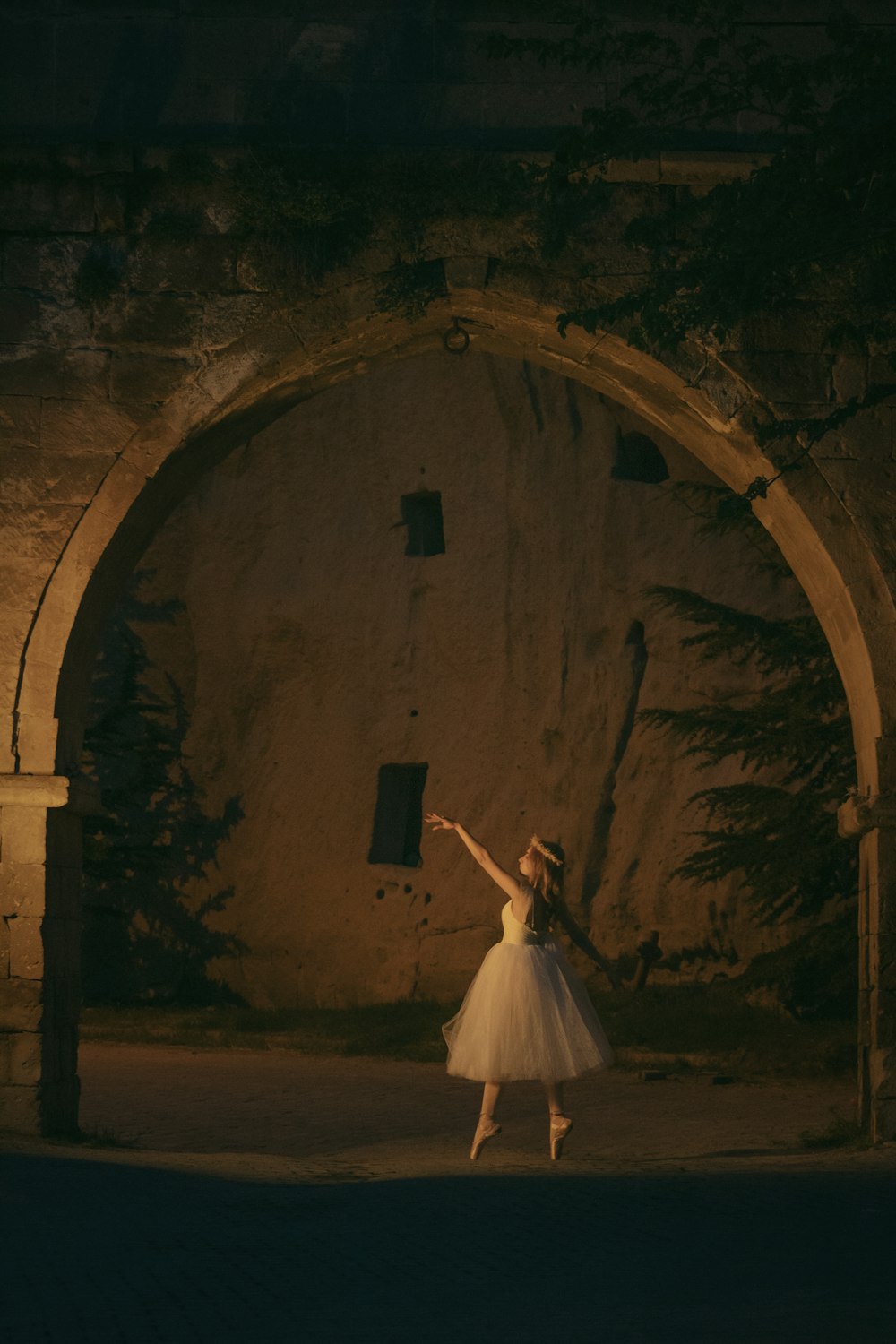 a woman in a white dress is dancing