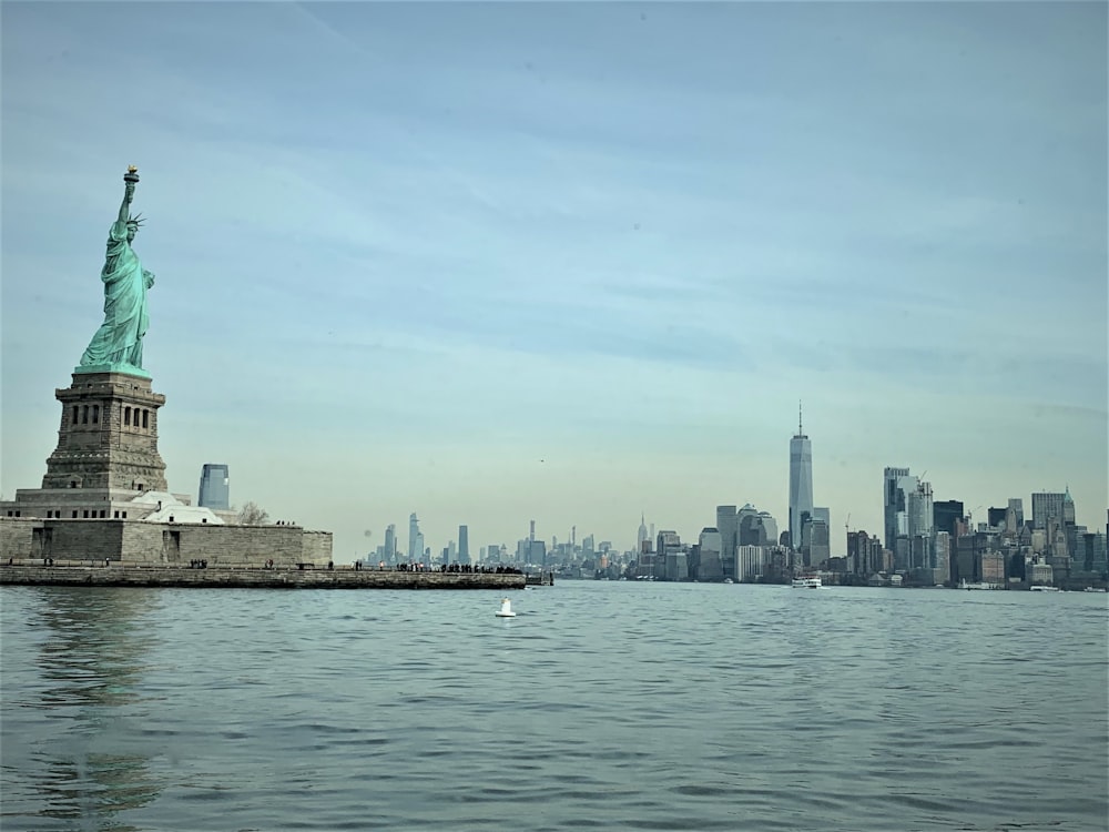 the statue of liberty is in the middle of the water