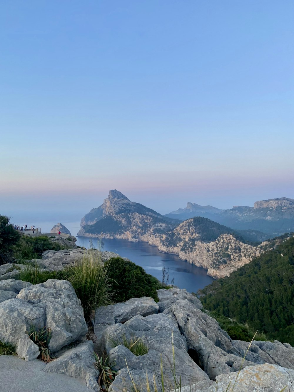 a view of a lake from the top of a mountain