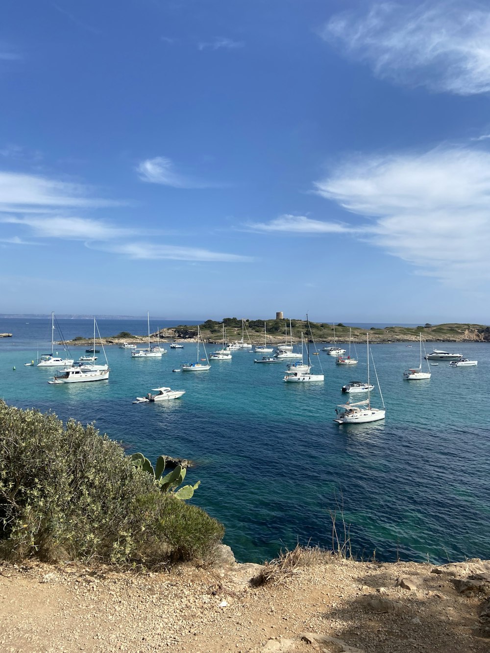 a group of boats floating on top of a body of water