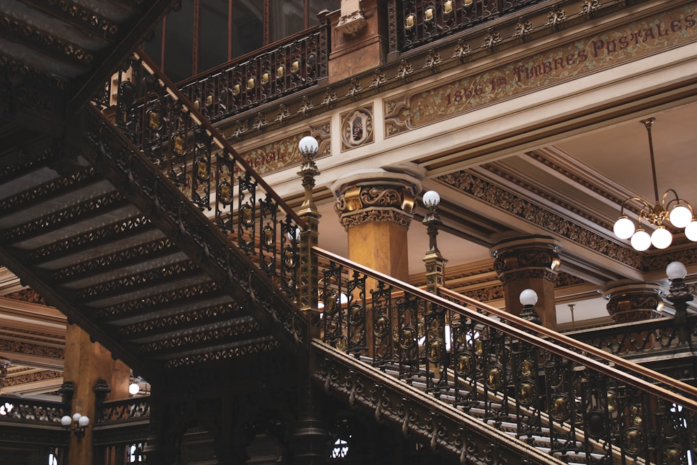 a staircase in a building with a clock on the wall