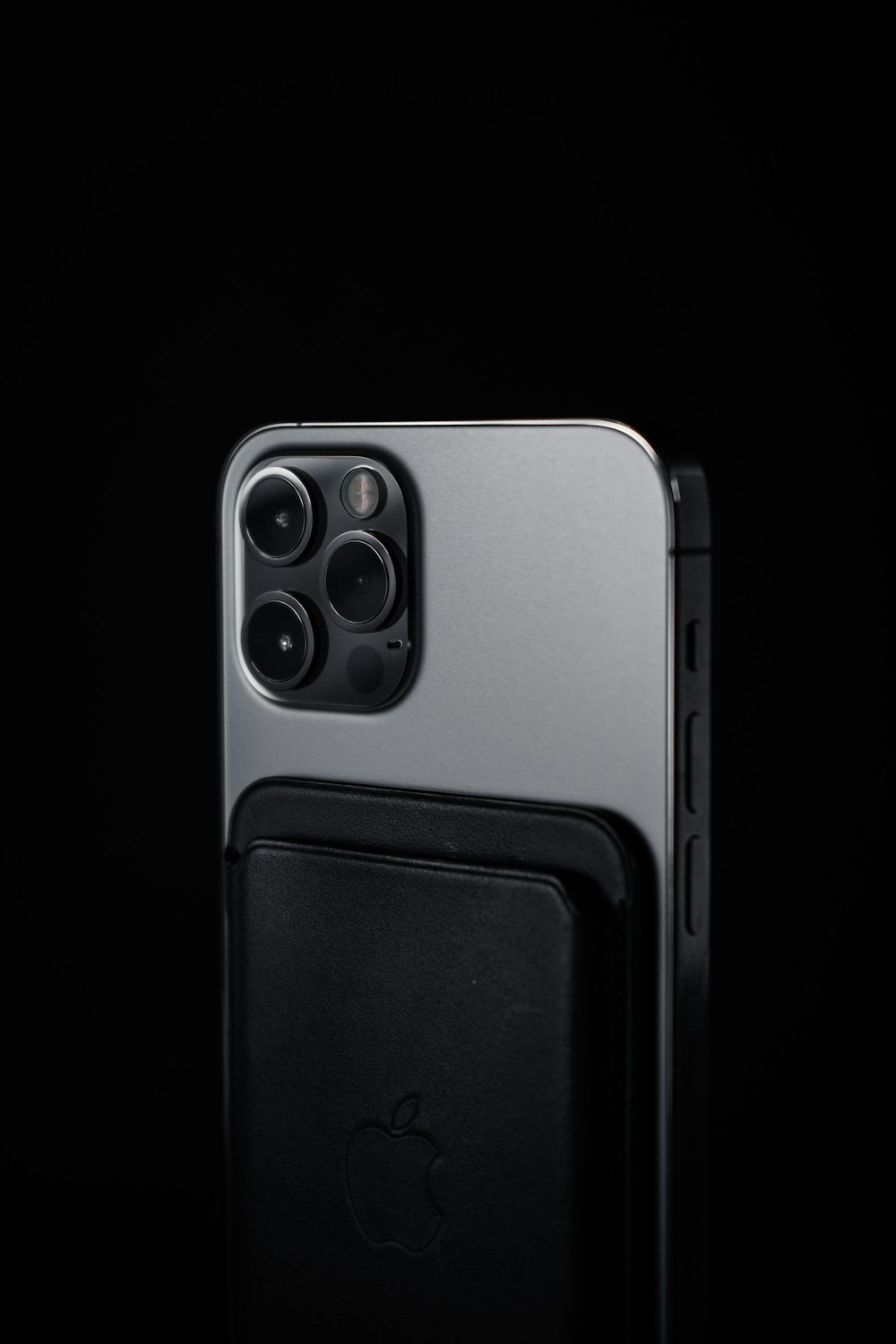 a close up of a cell phone with a black background