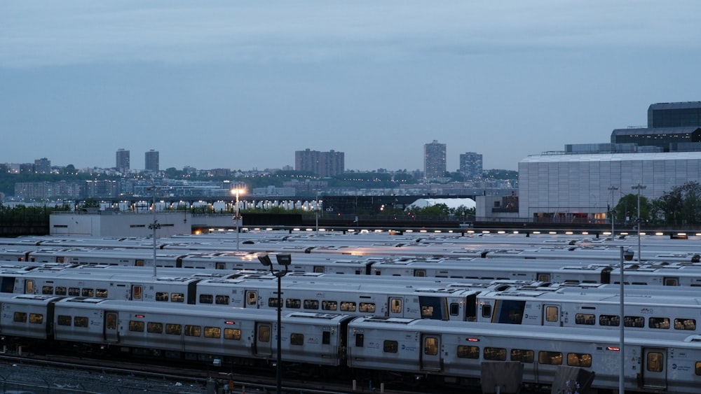 a bunch of trains that are parked in a lot