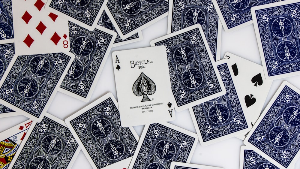 a pile of blue and white playing cards