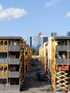Construction site with workers building a modern residential complex