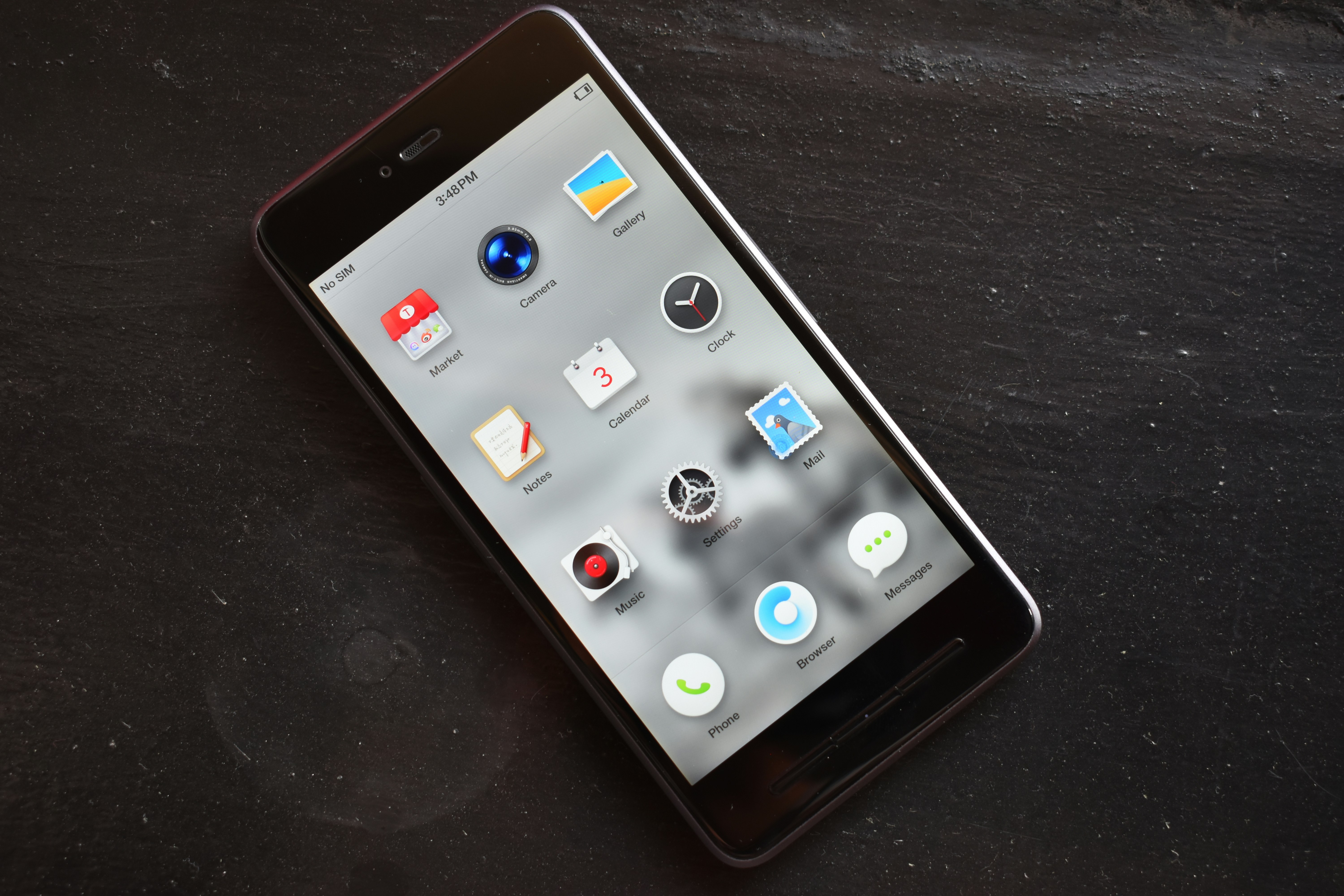 Smartphone screen showing clean minimal app interface on dark background, soft studio lighting