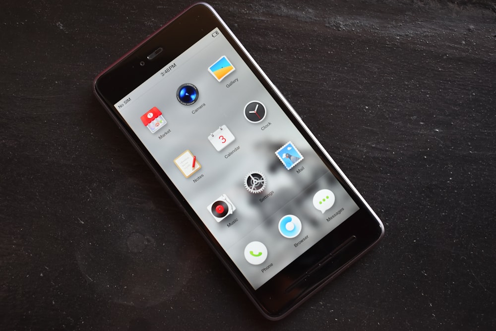 a black tablet sitting on top of a table