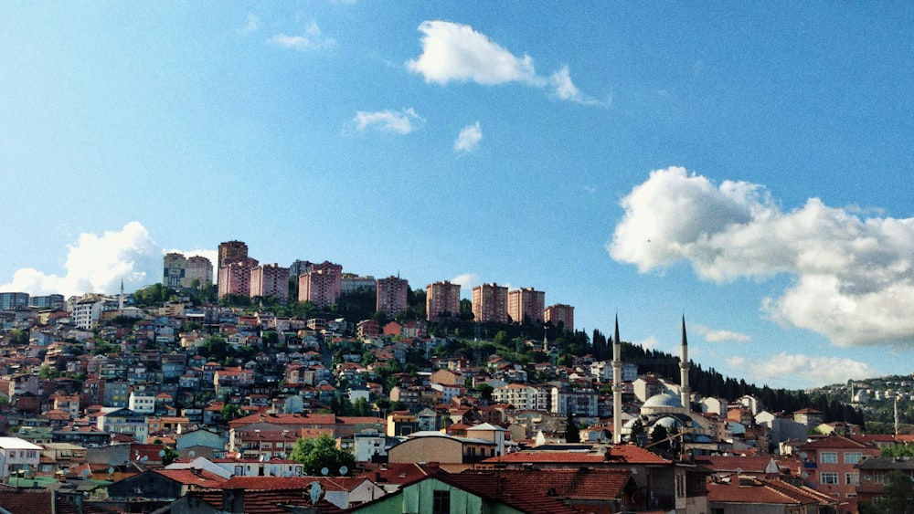 a view of a city with a hill in the background