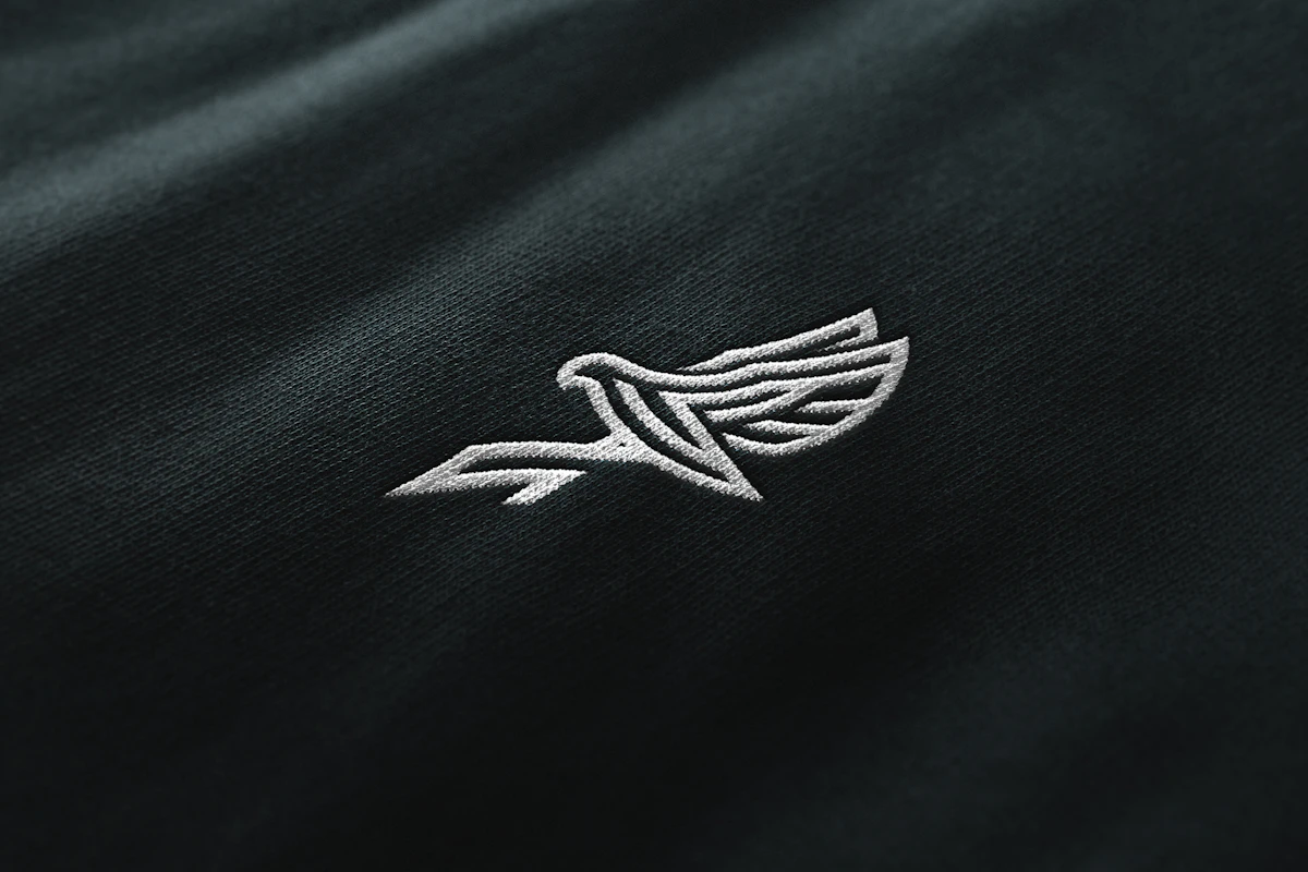 Black shirt with a white embroidered bird