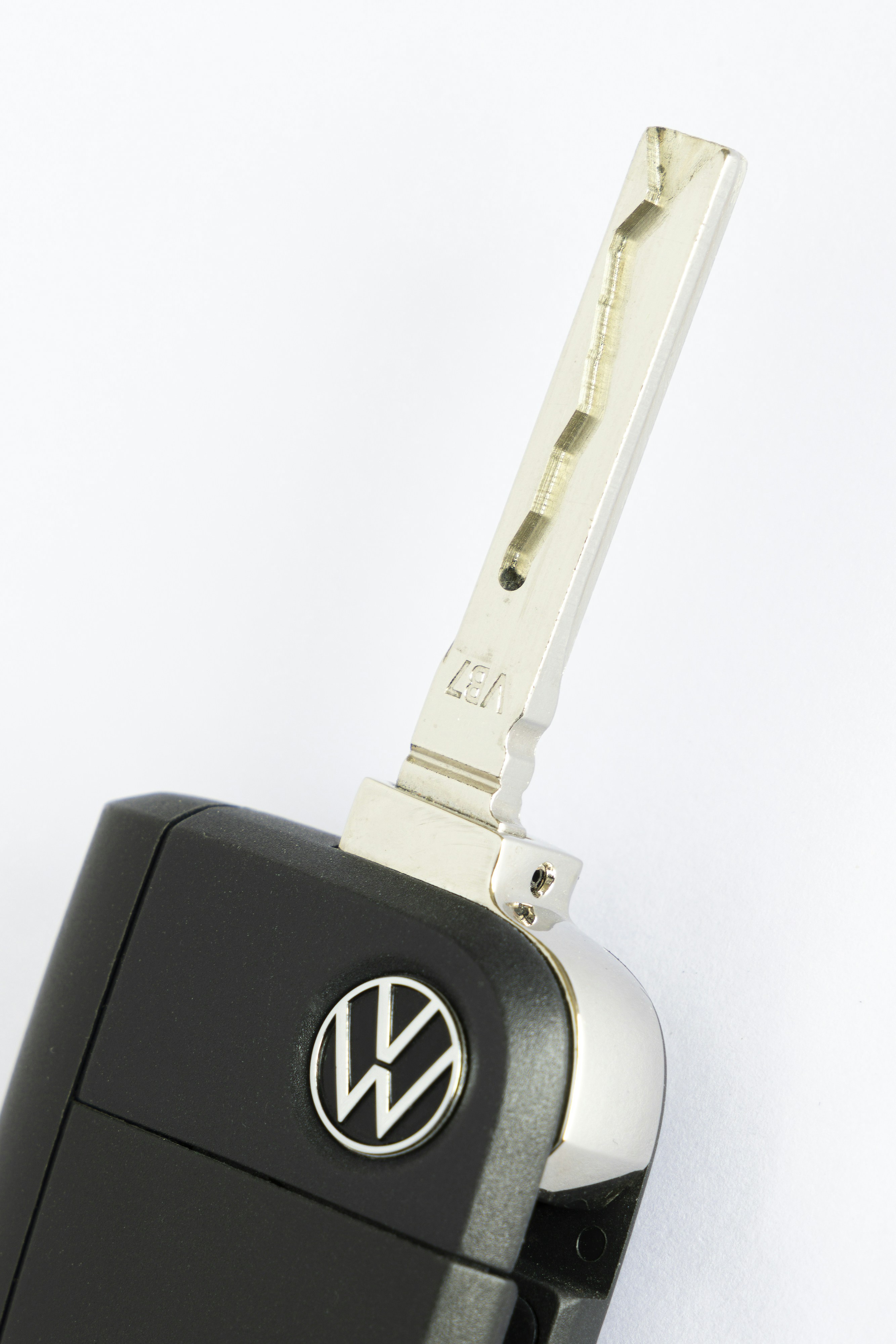 a volkswagen key chain attached to a car key