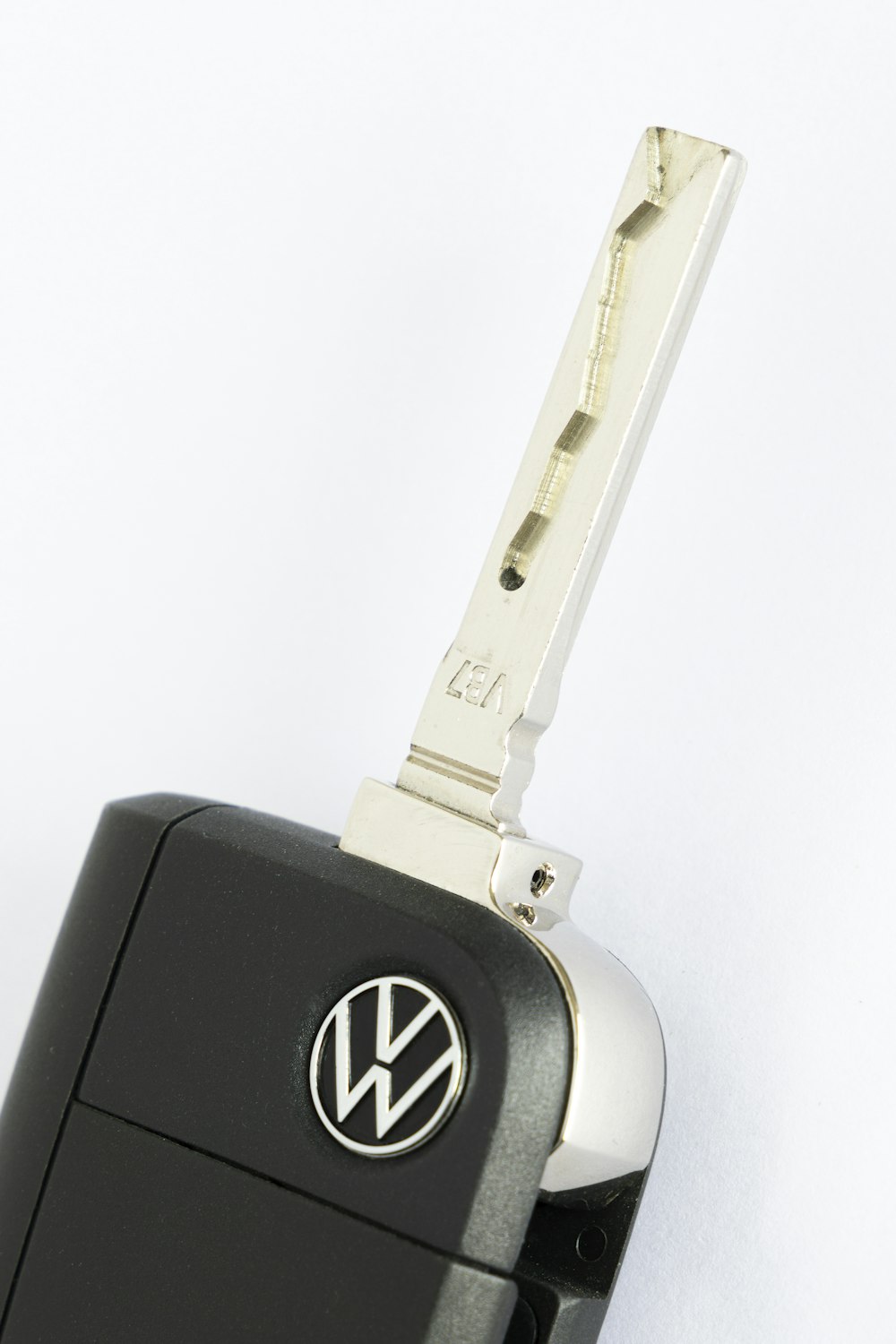 a volkswagen key chain attached to a car key