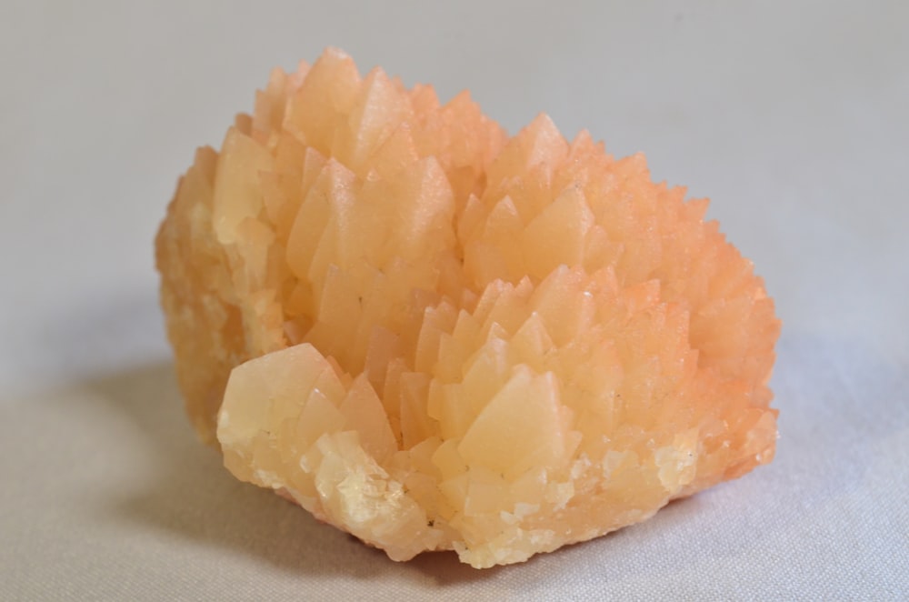 a close up of a piece of orange rock