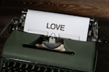 Vintage typewriter with a manuscript page showing handwritten romantic prose.