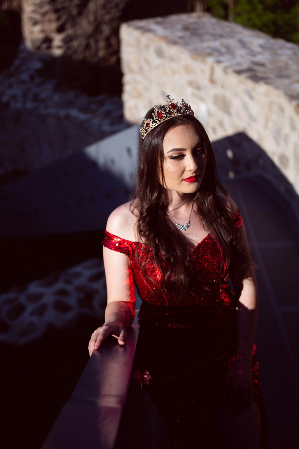 a woman in a red dress and a tiara