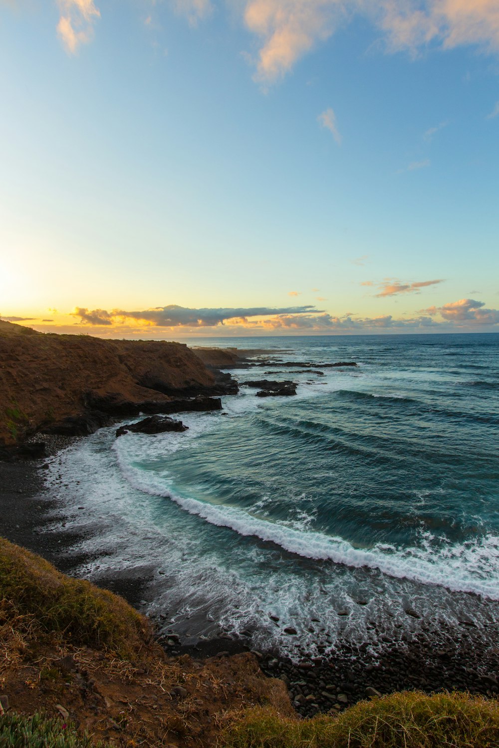 a view of the ocean from a cliff