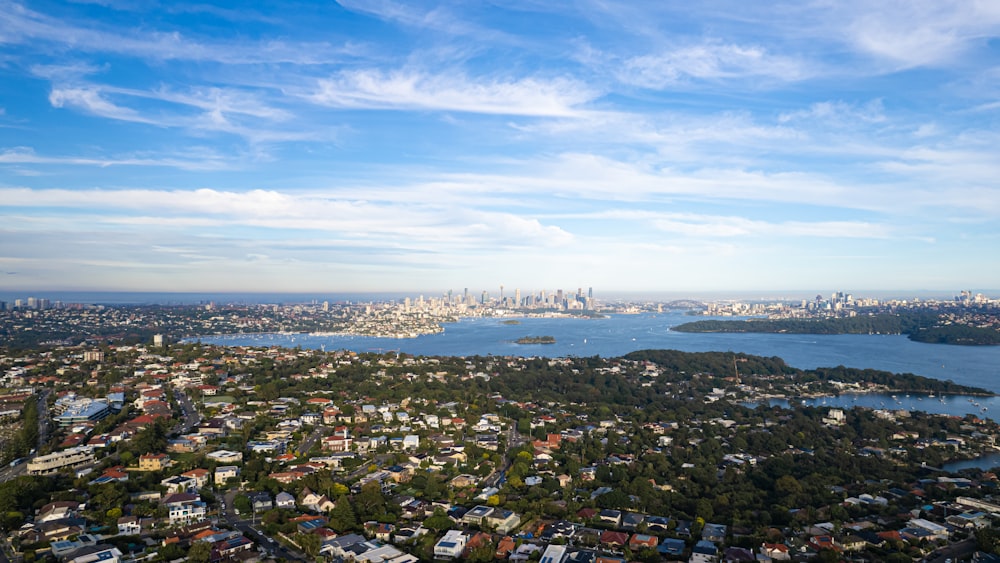 an aerial view of a city and a body of water