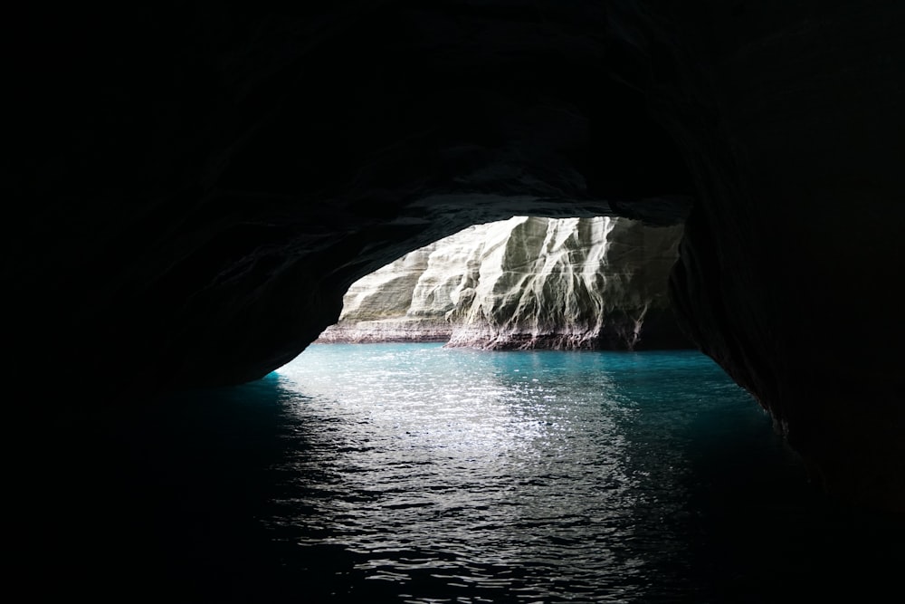 a view of the inside of a cave from the water