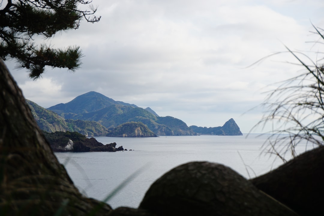 a large body of water surrounded by mountains,